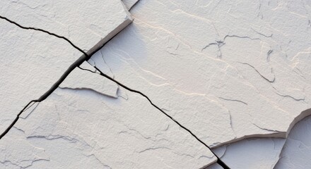 Cracked gray stone surface creates an abstract textured background