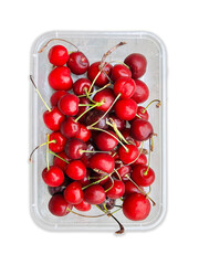 Cherries. Fresh red cherries top view. Ripe cherry fruit in plastic container on white background....