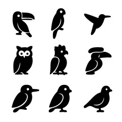 Fototapeta premium Rainforest Bird Icons. Solid, filled icon set of rainforest birds: toucan, macaw, hummingbird, owl, harpy eagle, hornbill,