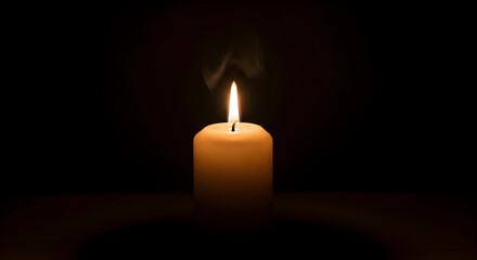 burning candle on a dark background