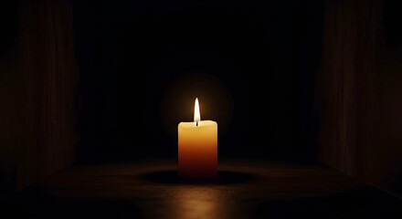 burning candle on a dark background
