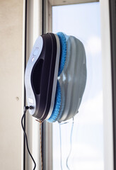 Robot washer washes window, window cleaning process with modern household appliances