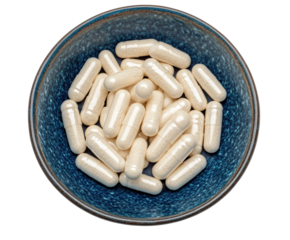 Supplement capsules in decorative bowl kitchen health concept isolated on transparent background