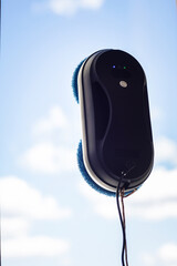Robot washer washes window, window cleaning process with modern household appliances