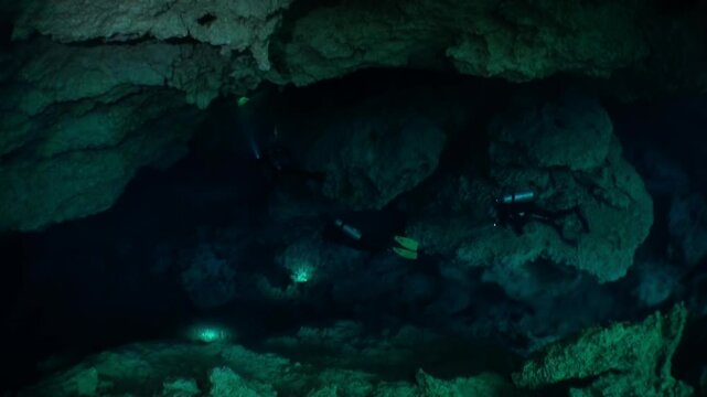 Beneath the surface, scuba divers navigate the submerged caves of the Yucatan Peninsula. The turquoise waters reveal a hidden world in Mexico's mysterious cenotes, echoing Mayan mythology.