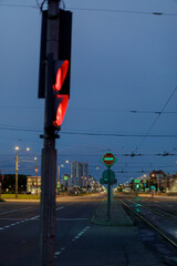 Traffic lights, street signs, and tram tracks at the intersection of Slavy Avenue and...