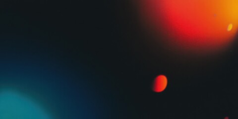 Abstract dark background with bright red and orange blurred lights. Bokeh effect for modern design or overlay element.