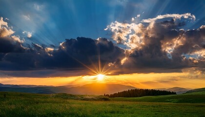 Obraz premium dramatic sunset with sun rays piercing through cloud cover over grassy landscape generative ai