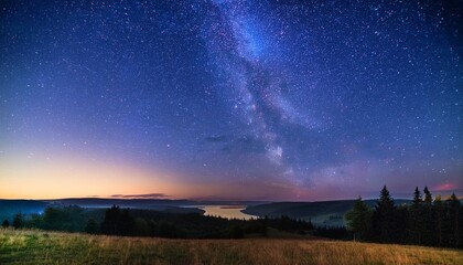 starry night sky over a quiet landscape filled with shimmering lights and tranquility
