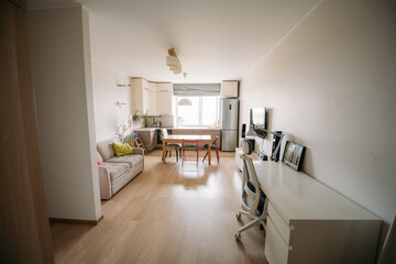 A spacious kitchen-living room in the apartment. No one, no people.