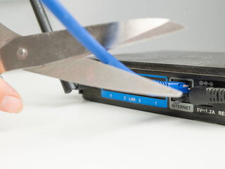 Scissors cut the router cables. 