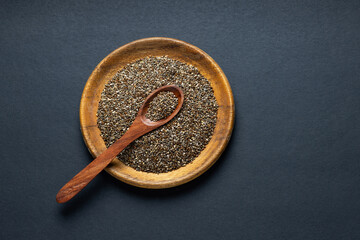 Salvia hispanica - Organic chia seeds in the bowl and on the spoon