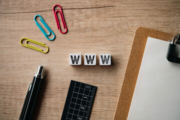 There is wood cube with the word WWW. It is an abbreviation for World Wide Web as eye-catching image.