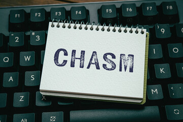 There is notebook with the word CHASM. It is as an eye-catching image.
