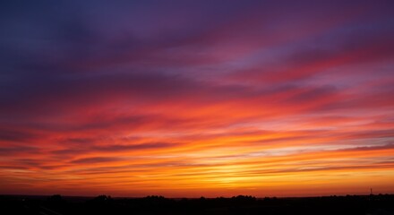 Fototapeta premium Fiery Sunset - A Dramatic Sky with Colorful Clouds