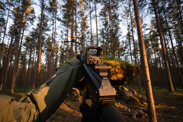 First-person view: a soldier in tactical gear aims an assault rifle with a red dot sight at a drone...