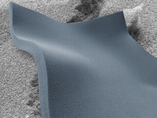 one sheet of bluish gray sponge foam material on a rough surface