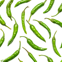 A vibrant collection of fresh green chili peppers. The peppers are scattered and show a spectrum of their natural form.