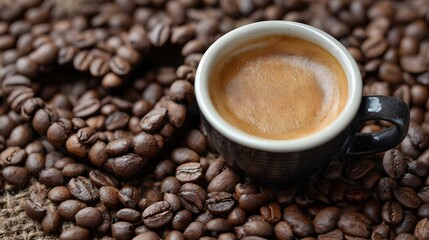 Fototapeta premium Delicious espresso coffee cup with roasted coffee beans for background and morning drink concept