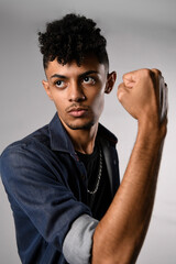 model young slim man in denim shirt in kung fu defense pose