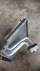 Cooling system and aircond service showing radiator, water pump, condenser, pulley, and dashboard...