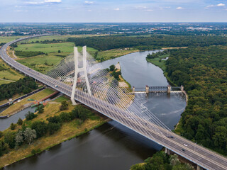 Cable stayed bridge over Odra river with cars driving on highway in Wroclaw, Poland