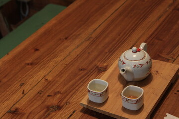 A traditional Chinese tea set on rustic wooden table