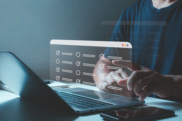 Online survey form with digital checklist and checkbox on laptop screen, business evaluation,...