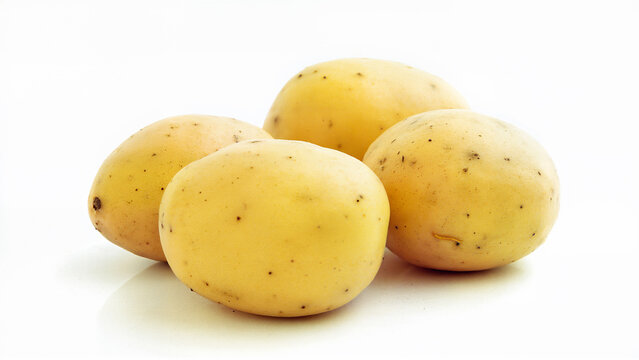 Raw potatoes isolated on a white background, showing their natural yellow skin and smooth texture. Suitable for food, nutrition, agriculture, and healthy eating concepts in isolated product