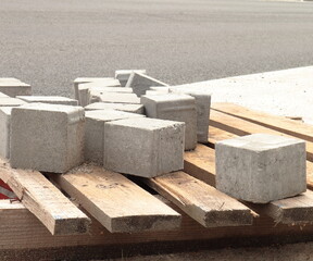 concrete blocks on construction site, betonelle autobloccanti per marcapiedi e pavimentazione esterna
