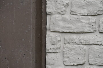 Cement wall. Two tone. Bricks and solid cement.