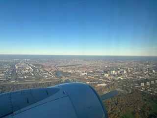 View of city through airplane window during flight