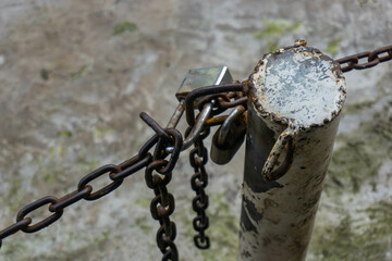 rusty chain-link fence and padlock