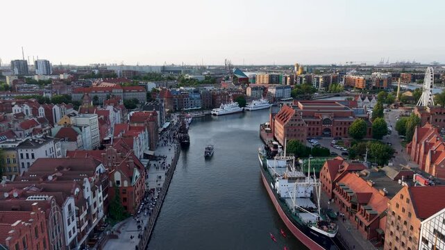 Aerial drone shot above Gdansk Moltlawa River, view of the city architecture and river, Poland. Slow motion	