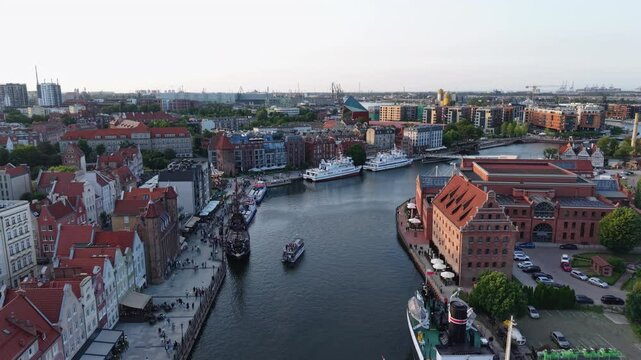 Aerial drone shot above Gdansk Motlawa River, view of the city architecture and river, Poland. Slow motion	