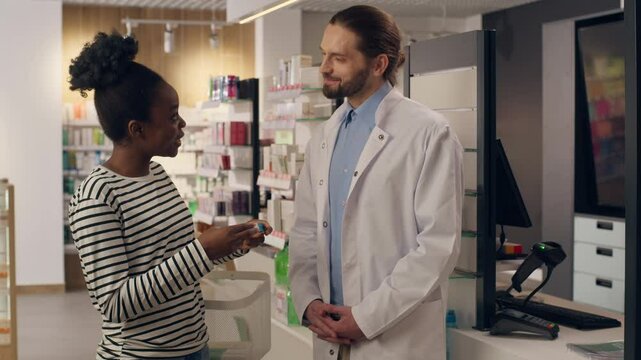 Pharmacist help customer medicine choice in pharmacy African American woman buying pills vitamins medication advice man doctor health care professional assisting drugstore pharmaceutical consultation