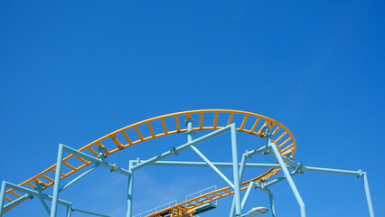 Rollercoaster Against Blue Sky