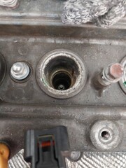 Car engine repair showing throttle body cleaning, sensor inspection, and spark plug maintenance during regular vehicle servicing