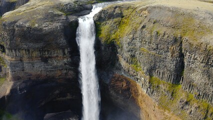 Aerial view of the spectacular Haifoss waterfall and Fossaa River is a waterfall situated in southern Iceland. The waterfall  drops from a height of 122 meters.