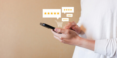 close up man hand hold smartphone and checking rating score of product on marketplace website before make cashless payment by credit card for customer satisfy and online shopping concept