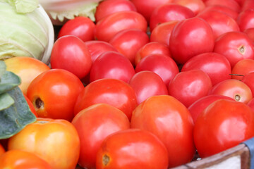Ripe tomatoes in a fresh vegetable shop