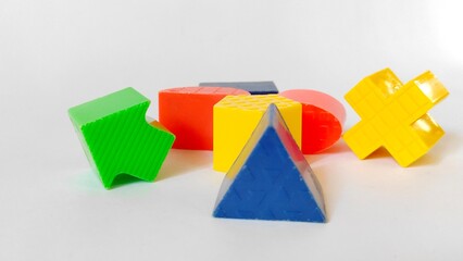 Colorful plastic geometric shapes for kids isolated on white background. 