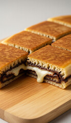 Sweet thick pancake bursting with melted cheese, chocolate, and nuts