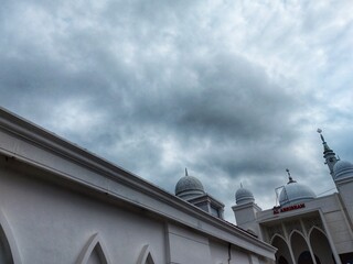 White mosque, in tulungagung city with cloudy sky background