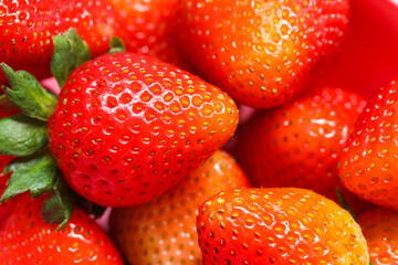 Close-up of ripe strawberries as background.