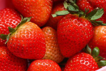 Close-up of ripe strawberries as background.