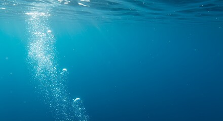 Underwater Bubbles Rising in Deep Blue Ocean