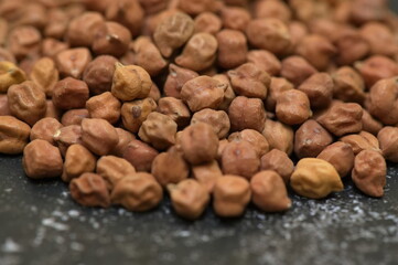 Raw chick peas, Chickpeas, Sundal also know as Chana Kondakadalai sundal closeup macro shot with cup.