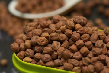 Raw chick peas, Chickpeas, Sundal also know as Chana Kondakadalai sundal closeup macro shot with cup.
