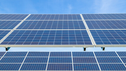 Blue solar panels on sky background. Solar power plant. Solar farm, Alternative source of...
